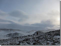 A rocky plateau, and some strong winds affecting the clouds.