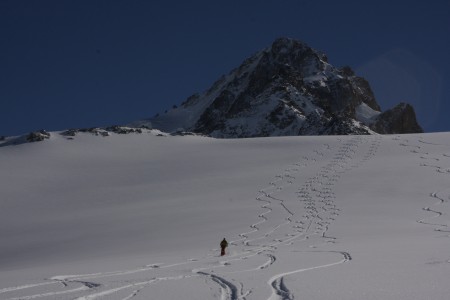 Just perfect snow below the col. Stuart putting some turns in